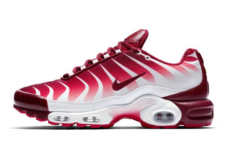 pink and white nike tns